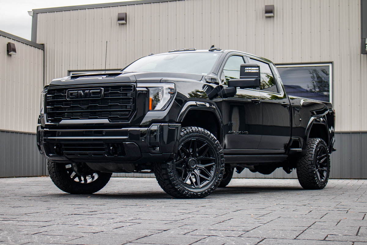2026 GMC Sierra 2500 AT4 with GMC Stock suspension, 22x10 Fuel Flux wheels, and 35" Nitto Ridge Grappler tires.