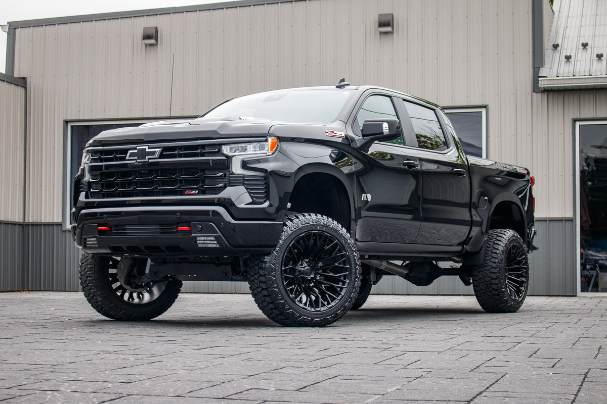 2025 Chevrolet Silverado 1500 LT Trail Boss with a 6" Rough Country lift kit, 22x12 Fuel Strike wheels, and 35" Fury Country Hunter R/T tires.