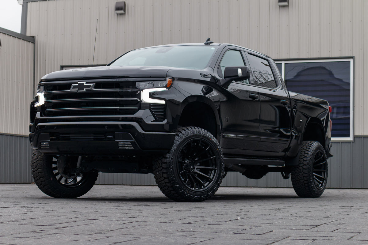 2024 Chevrolet Silverado 1500 High Country lift kit, 22x12 Fuel Burn wheels, and 35" Fury Country Hunter R/T tires.