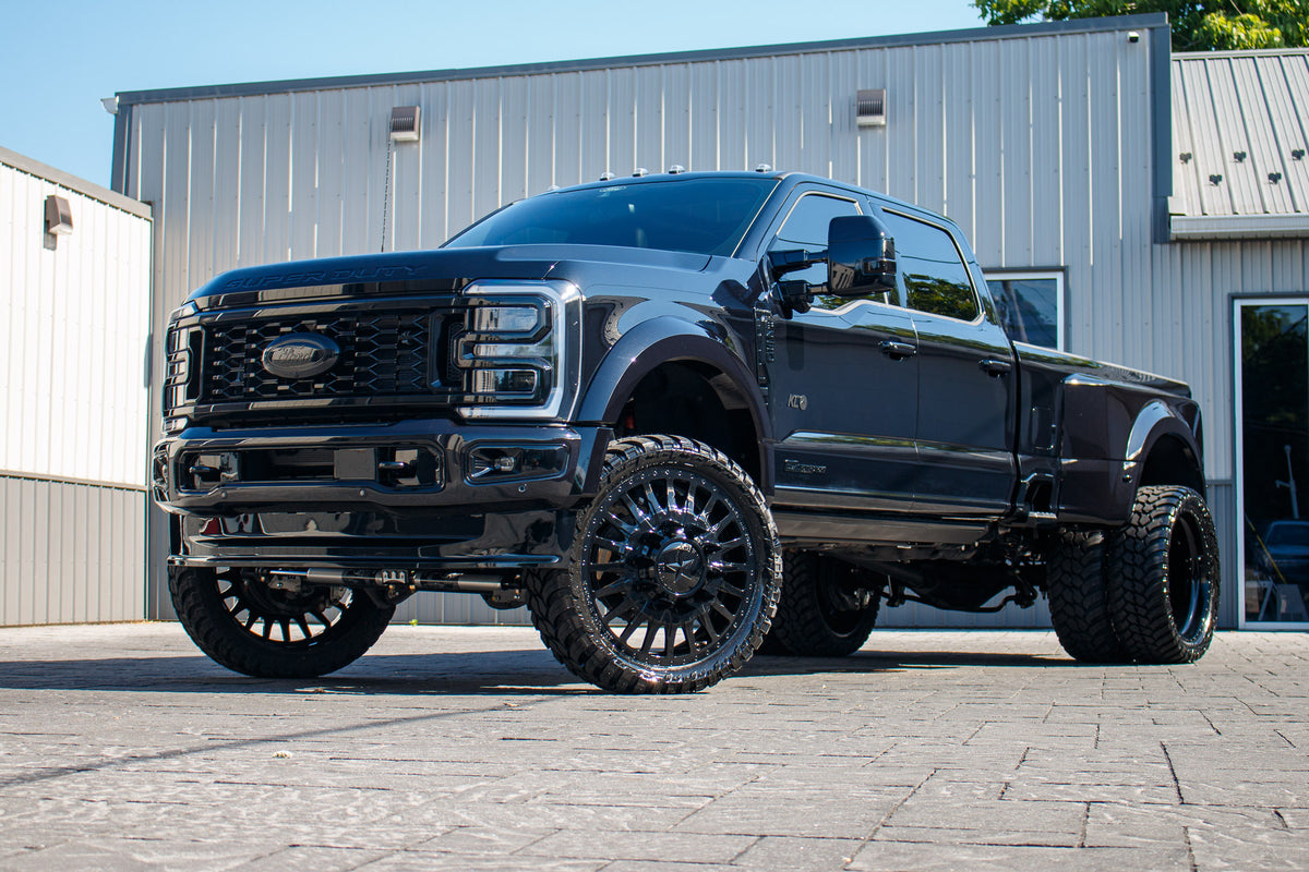 2026 Ford F-450 Super Duty Platinum with a 4" Wicked lift kit, 26x8.25 American Force Reactor wheels, and 37" AMP Terrain Attack M/T A tires.