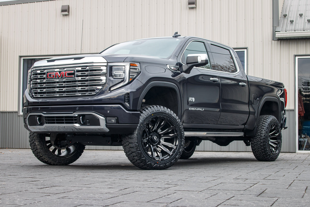 2024 GMC Sierra 1500 Denali with a 6" Rough Country suspension kit, 22x12 Fuel Blitz wheels, and 35" Fury Country Hunter R/T tires.