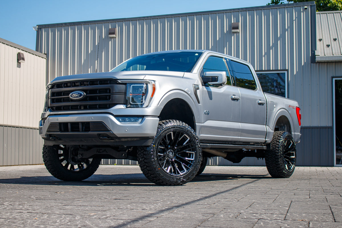 2023 Ford F-150 XLT with a 6" Rough Country lift kit, 22x12 Fuel Rebar wheels, and 35" Fury Country Hunter R/T tires.