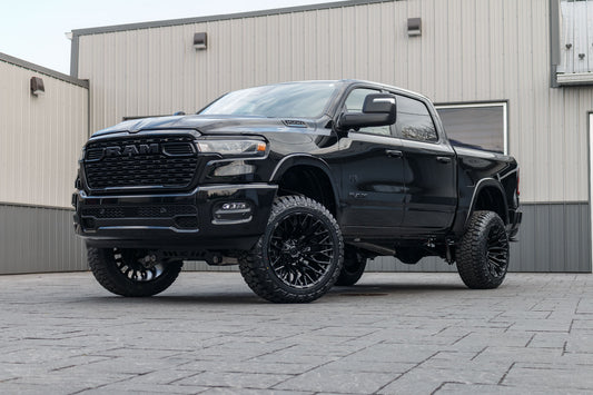 2025 Ram 1500 Big Horn with a 6" Rough Country lift kit, 22x12 Fuel Strike wheels, and 35" Fury Country Hunter R/T tires.