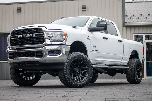 2024 Ram 2500 Big Horn with a 5" Rough Country lift kit, 22x12 Fuel Flux wheels, and 37" Nitto Ridge Grappler tires.
