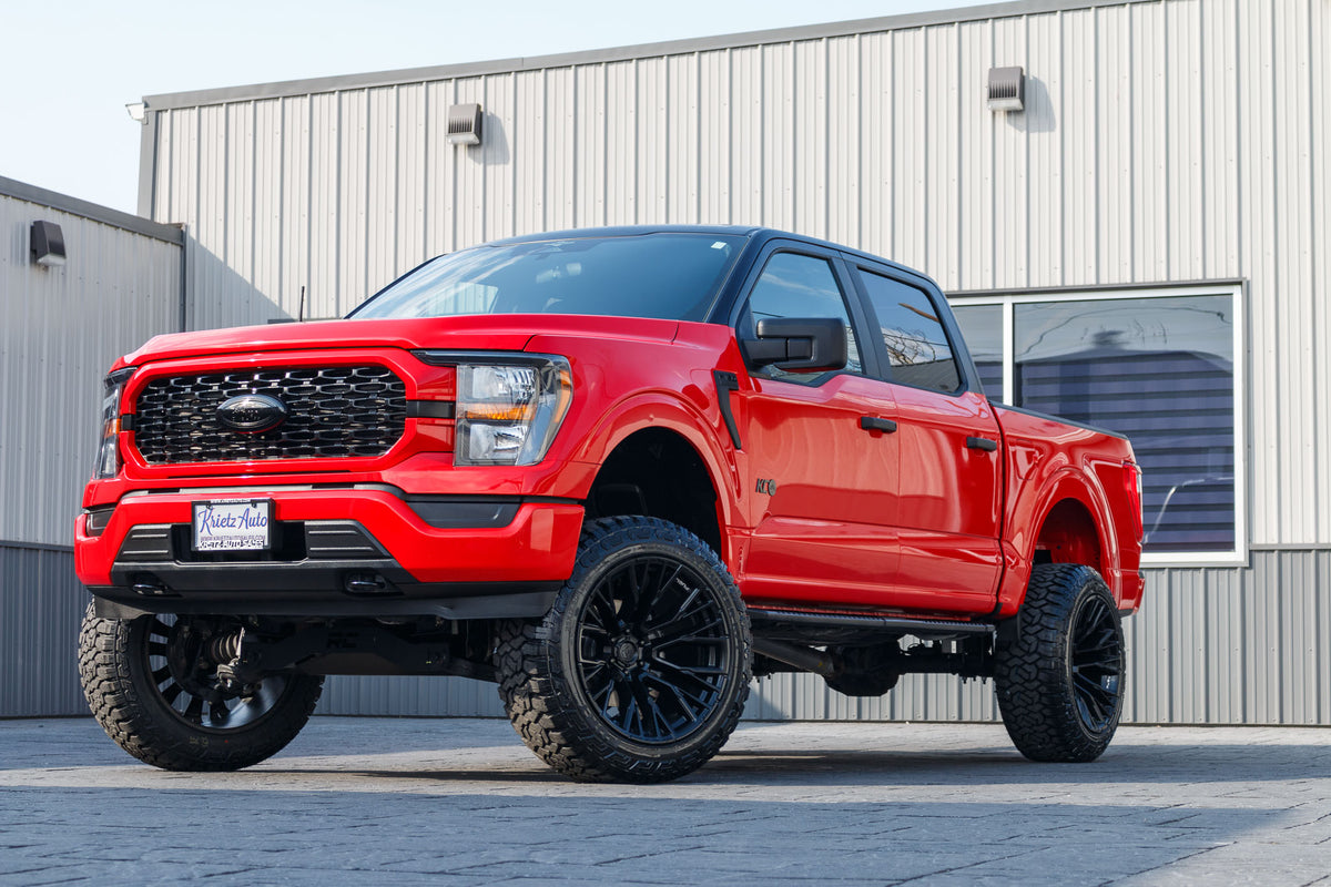 2023 Ford F-150 XLT with a 6" Rough Country lift kit, 22x12 Fuel Rebar wheels, and 35" Fury Country Hunter R/T tires.