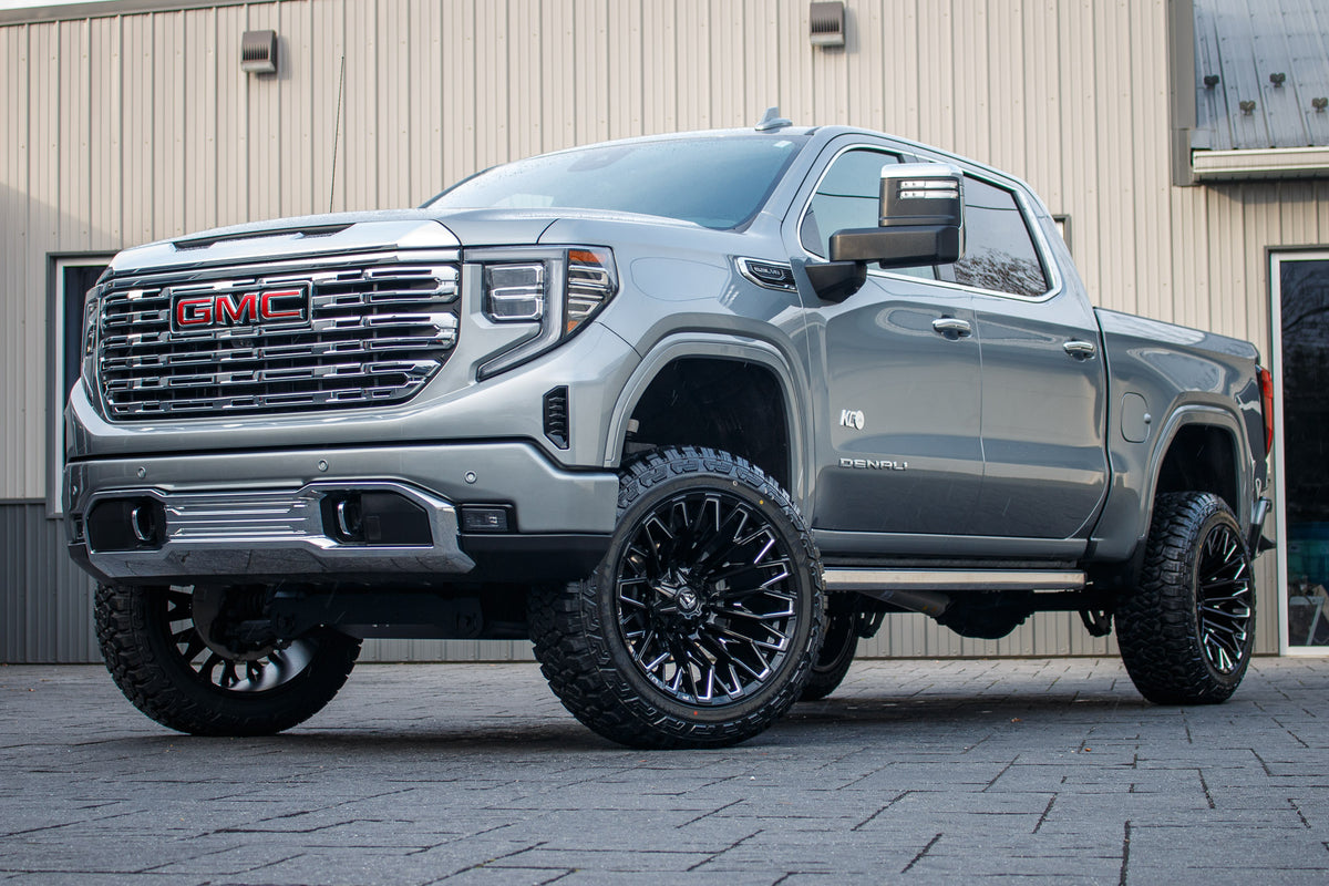 2024 GMC Sierra 1500 Denali with a 6" Rough Country suspension kit, 22x12 Fuel Strike wheels, and 35" Fury Country Hunter R/T tires.