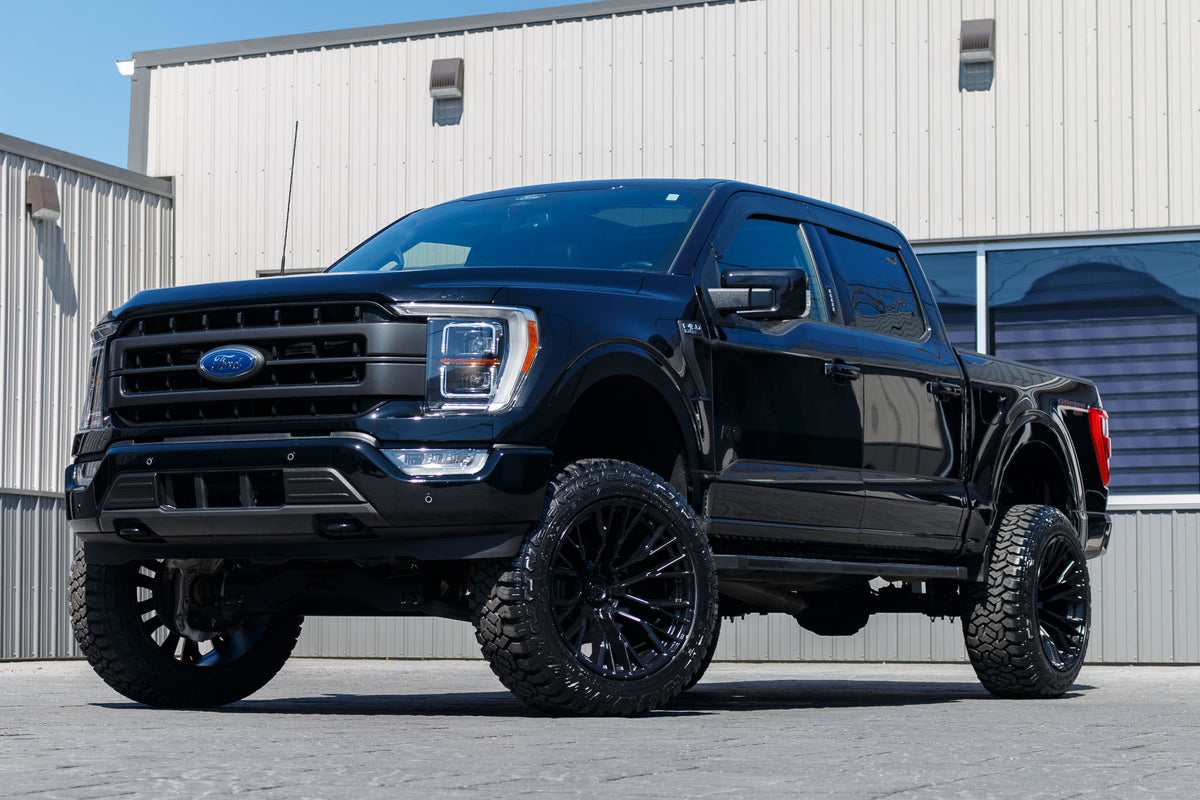 2022 Ford F-150 Lariat with a 6" Rough Country lift kit, 22x12 Fuel Rebar wheels, and 35" Fury Country Hunter R/T tires.
