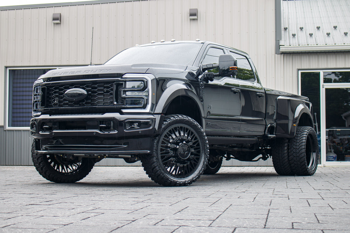 2026 Ford F-450 Super Duty Platinum with a 4" Wicked lift kit, 26x8.25 American Force Business wheels, and 37" AMP Terrain Attack M/T A tires.