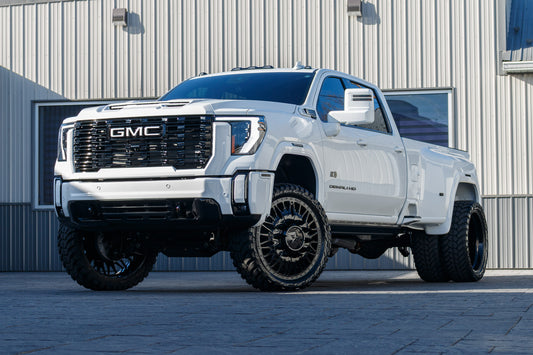 2025 GMC Sierra 3500 Denali Ultimate with a 4" CST lift kit, 26x8.25 American Force Plague wheels, and 37" AMP Terrain Attack M/T A tires.