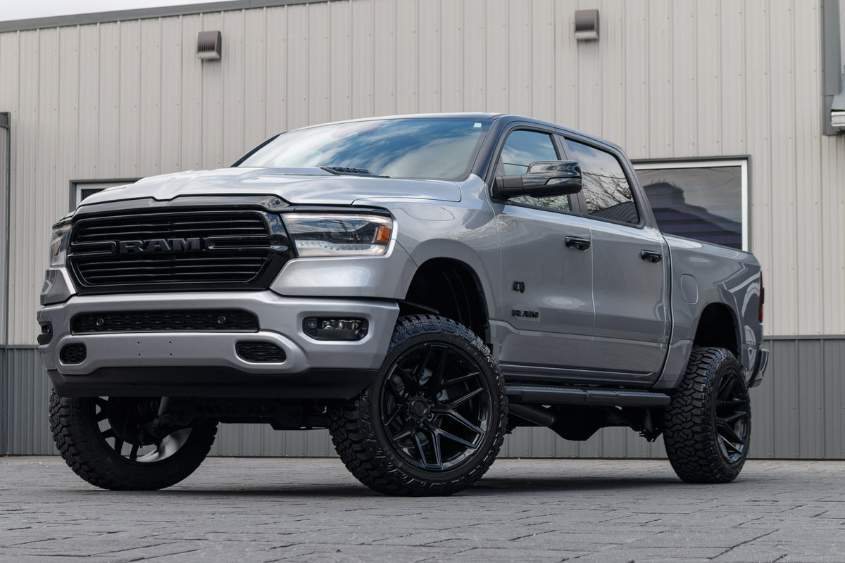 2023 Ram 1500 Laramie with a 6" Rough Country lift kit, 22x12 Fuel Flux wheels, and 35" Fury Country Hunter R/T tires.