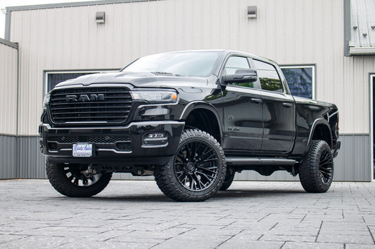 2025 Ram 1500 Laramie with a 6" Rough Country lift kit, 22x12 Fuel Rebar wheels, and 35" Fury Country Hunter R/T tires.