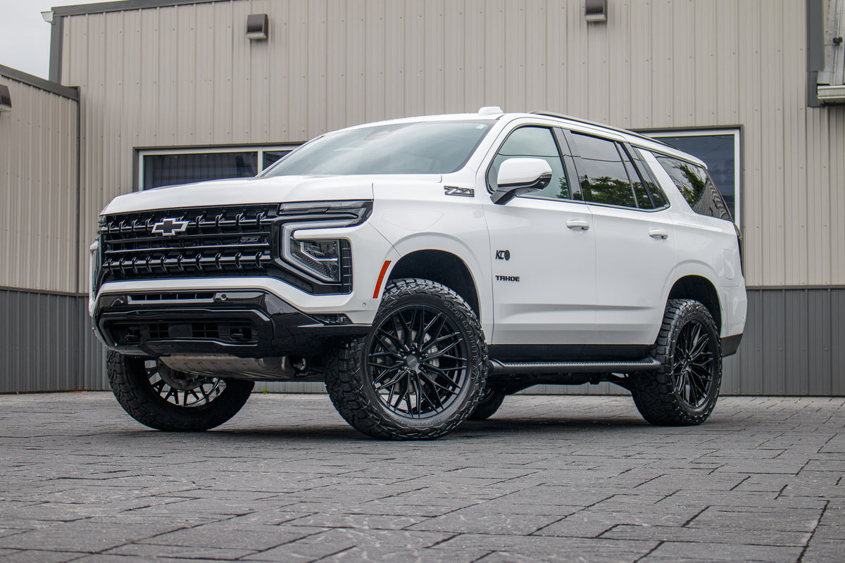 2026 Chevrolet Tahoe Z71 with a 2" Rough Country lift kit, 22x9.5 Vossen HFX6 wheels, and 35" Nitto Recon Grappler A/T tires.
