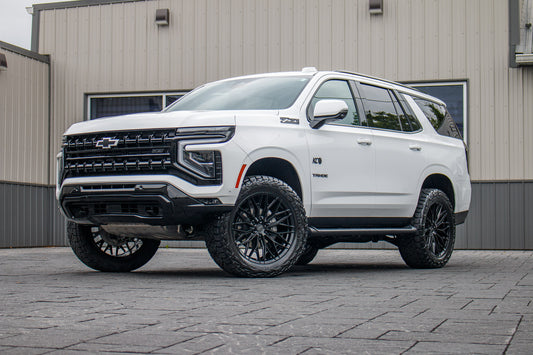 2026 Chevrolet Tahoe Z71 with a 2" Rough Country lift kit, 22x9.5 Vossen HFX6 wheels, and 35" Nitto Recon Grappler A/T tires.