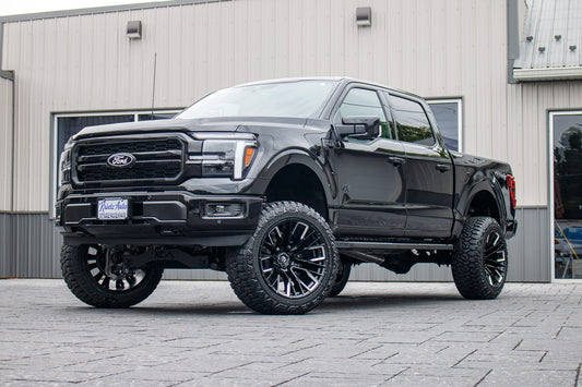 2026 Ford F-150 Lariat with a 6" Rough Country lift kit, 22x12 Fuel Rebar wheels, and 35" Fury Country Hunter R/T tires.