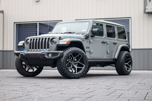2023 Jeep Wrangler Rubicon 4XE with Jeep Stock suspension, 22x12 Fuel Flux wheels, and 35" Fury Country Hunter R/T tires.