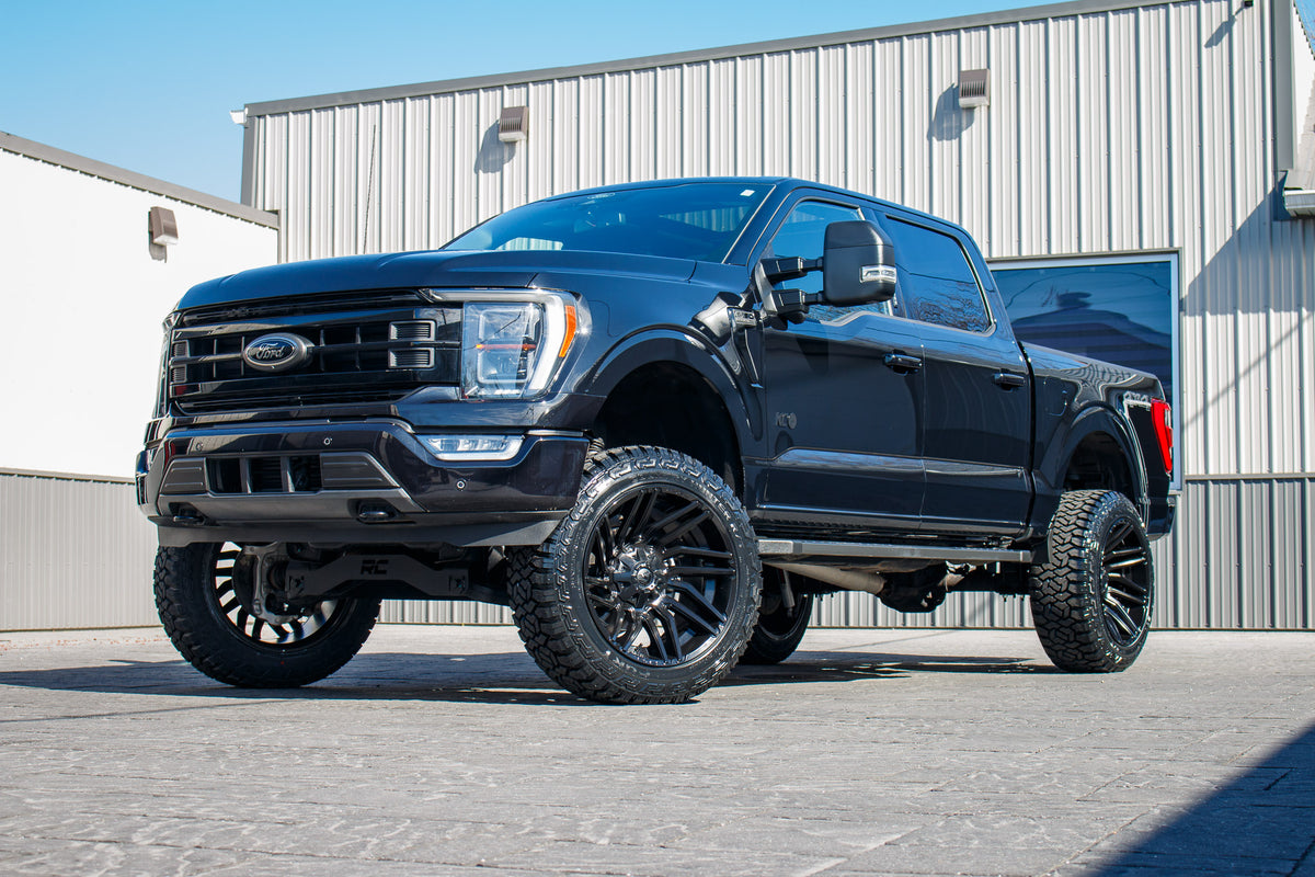 2022 Ford F-150 Lariat with a 6" Rough Country lift kit, 22x12 Fuel Typhoon wheels, and 35" Fury Country Hunter R/T tires.