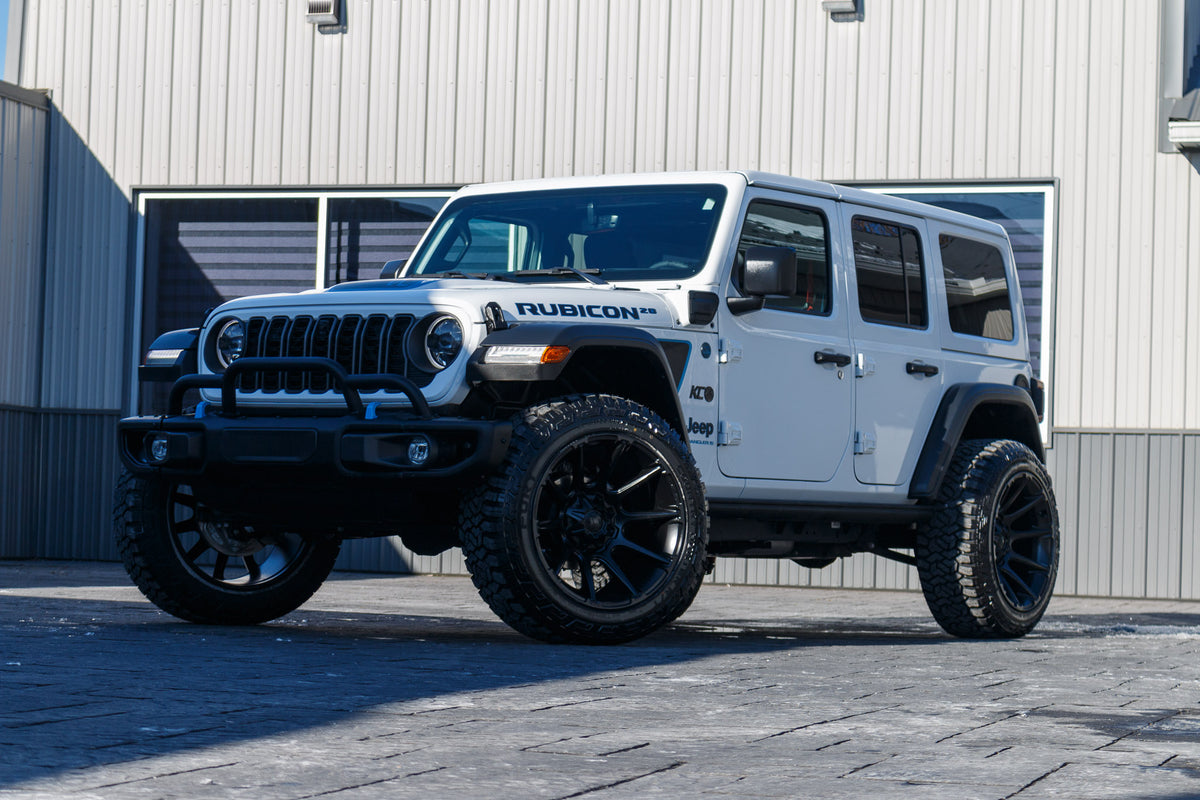 2023 Jeep Wrangler Unlimited Rubicon 4XE with Jeep Stock suspension, 22x12 Fuel Super C wheels, 35" Fury Country Hunter R/T tires.