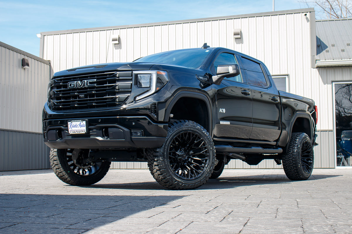 2025 GMC Sierra 1500 Elevation with a 6" Rough Country lift kit, 22x12 Fuel Strike wheels, and 35" Fury Country Hunter R/T tires.