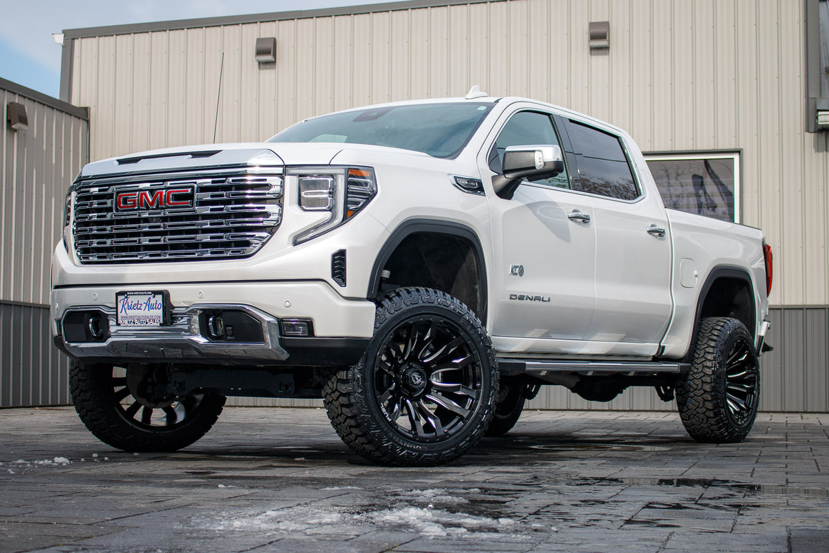 2022 GMC Sierra 1500 Denali with a 6" Rough Country suspension kit, 22x12 Fuel Blitz wheels, and 35" Fury Country Hunter R/T tires.