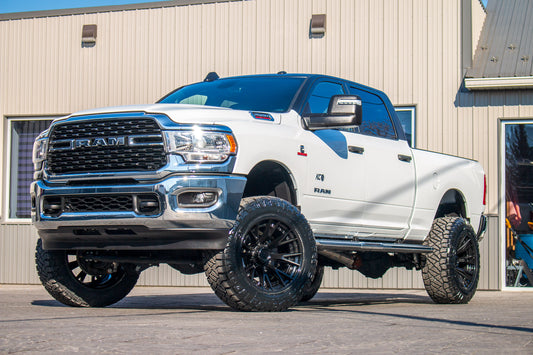2024 Ram 2500 Big Horn with a 5" Rough Country lift kit, 22x12 Fuel Catalyst wheels, and 37" Nitto Ridge Grappler tires.