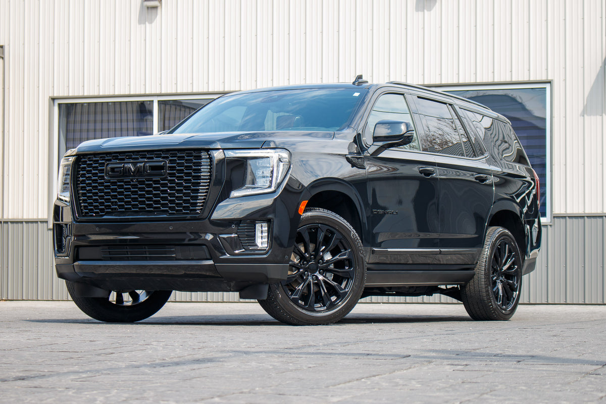 2024 GMC Yukon Denali Ultimate with GMC Factory suspension, 22x9 GMC Stock wheels, and Bridgestone Alenza tires.