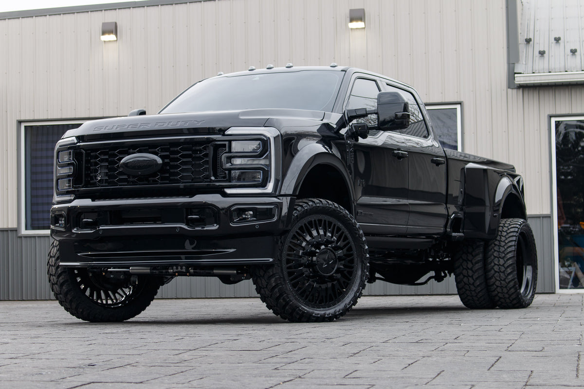 2024 Ford F-450 Super Duty Platinum with a 4" Wicked lift kit, 26x8.25 American Force Business wheels, and 37" AMP Terrain Attack M/T A tires.