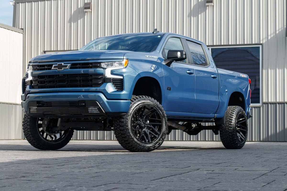 2024 Chevrolet Silverado 1500 RST with a 6" Rough Country lift kit, 22x12 TIS 554B wheels, and 35" Fury Country Hunter R/T tires.
