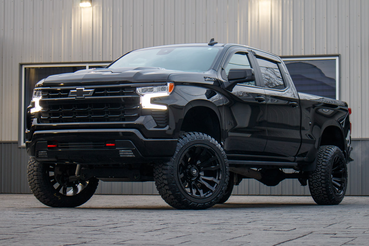 2024 Chevrolet Silverado 1500 LT Trail Boss with a 6" Rough Country lift kit, 22x12 Fuel Blitz wheels, and 35" Fury Country Hunter R/T tires.