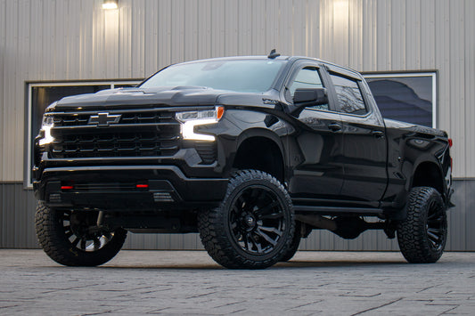 2024 Chevrolet Silverado 1500 LT Trail Boss with a 6" Rough Country lift kit, 22x12 Fuel Blitz wheels, and 35" Fury Country Hunter R/T tires.