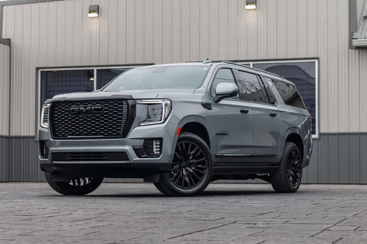2024 GMC Yukon XL Denali Ultimate with GMC Factory suspension, 22x9 GMC Stock wheels, and Bridgestone Alenza tires.