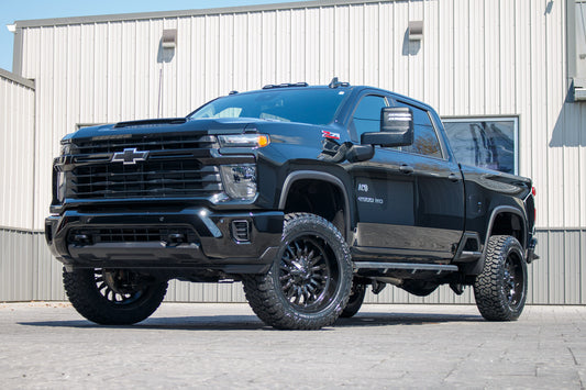 2025 Chevrolet Silverado 2500 Custom with a 3" Rough Country lift kit, 22x10 Fuel Arc wheels, and 35" Fury Country Hunter R/T tires.