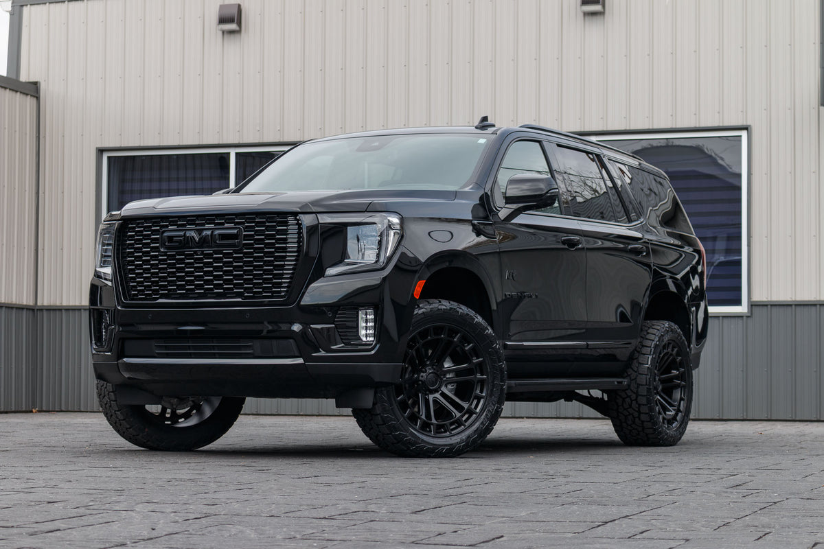 2024 GMC Yukon Denali with a 3" ReadyLift lift kit, 22x10 Fuel Heater wheels, and 295/50 Toyo Open Country AT3 tires.