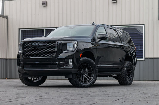 2024 GMC Yukon Denali with a 3" ReadyLift lift kit, 22x10 Fuel Heater wheels, and 295/50 Toyo Open Country AT3 tires.
