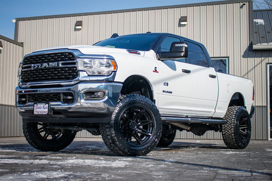 2024 Ram 2500 Big Horn with a 5" Rough Country lift kit, 22x12 Fuel Brawl wheels, and 37" Nitto Ridge Grappler tires.