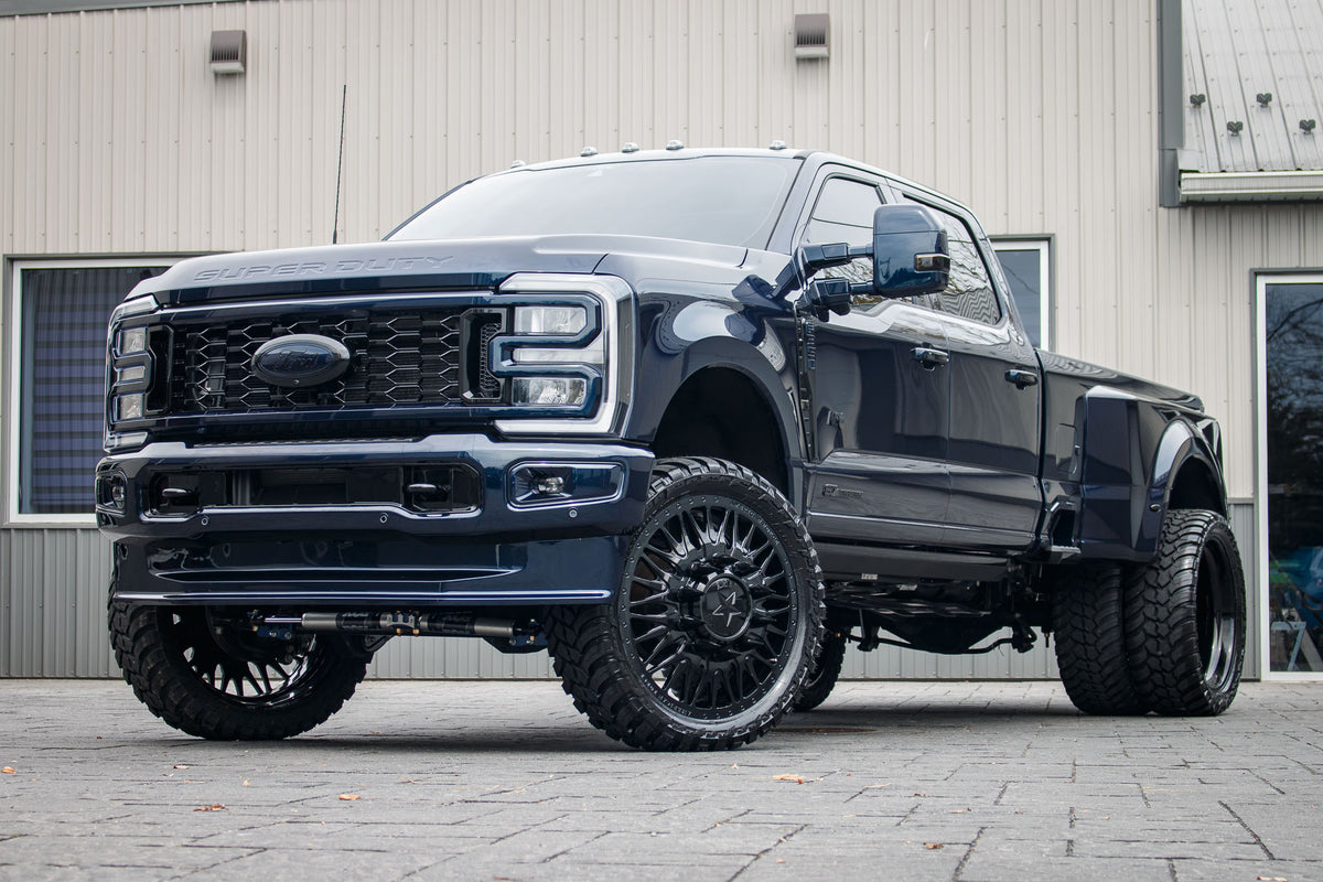 2024 Ford F-350 Super Duty Lariat with a 4" Wicked lift kit, 26x8.25 American Force Plague wheels, and 37" AMP Terrain Attack M/T A tires.
