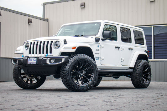 2022 Jeep Wrangler Unlimited Sahara 4XE with a 2.5" Rough Country lift kit, 22x12 Fuel Flame wheels, and 35" Fury Country Hunter R/T tires.