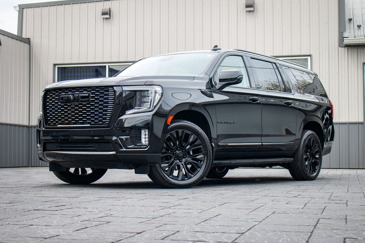 2024 GMC Yukon XL Denali with GMC Factory suspension, 22x9 GMC Stock wheels, and Bridgestone Alenza tires.