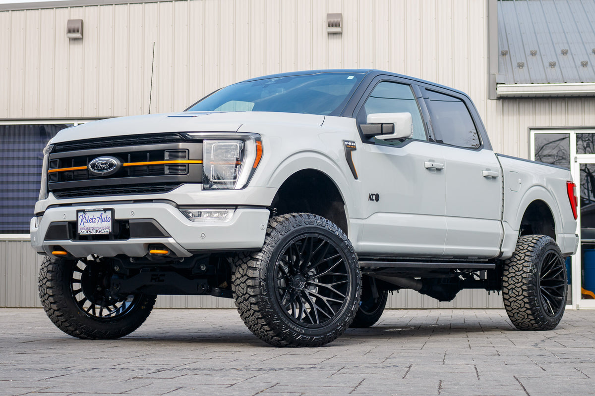 2023 Ford F-150 Tremor with a 6" Rough Country lift kit, 22x12 TIS 566B wheels, and 35" Fury Country Hunter R/T tires.