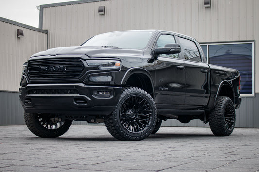 2024 Ram 1500 Limited with a 5" Rough Country lift kit, 22x12 Fuel Strike wheels, and 35" Fury Country Hunter R/T tires.