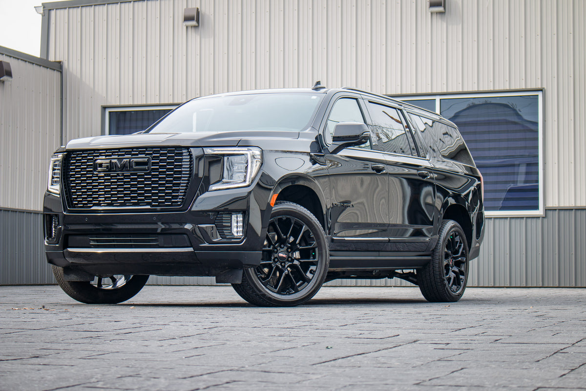 2024 GMC Yukon XL Denali with GMC Factory suspension, 22x9 GMC Stock wheels, and Bridgestone Alenza tires.