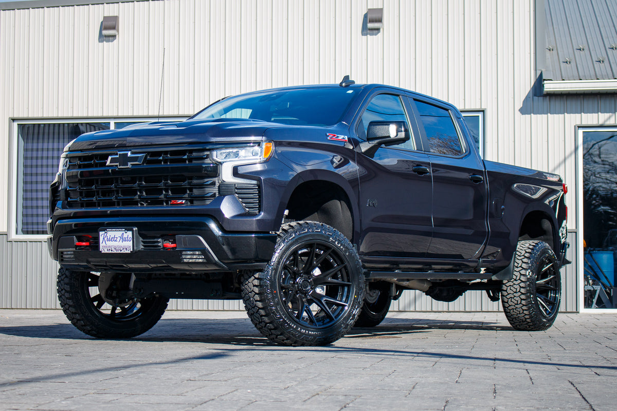 2022 Chevrolet Silverado 1500 LT Trail Boss with a 6" Rough Country lift kit, 22x12 Fuel Catalyst wheels, and 35" Fury Country Hunter R/T tires.