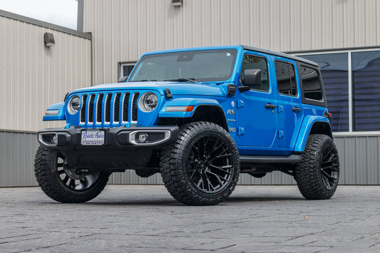 2022 Jeep Wrangler Unlimited Sahara 4XE with a 2.5" Rough Country lift kit, 22x12 Fuel Rebar wheels, and 35" Fury Country Hunter R/T tires.