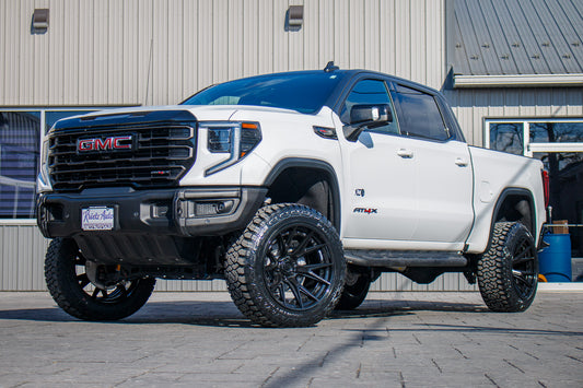 2024 GMC Sierra 1500 AT4X with a 4" ReadyLift lift kit, 22x12 Fuel Catalyst wheels, and 35" Fury Country Hunter R/T tires.
