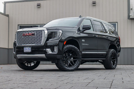 2024 GMC Yukon Denali with a 3" ReadyLift lift kit, 22x10 Fuel Flux wheels, and 295/50 Toyo Open Country AT3 tires.