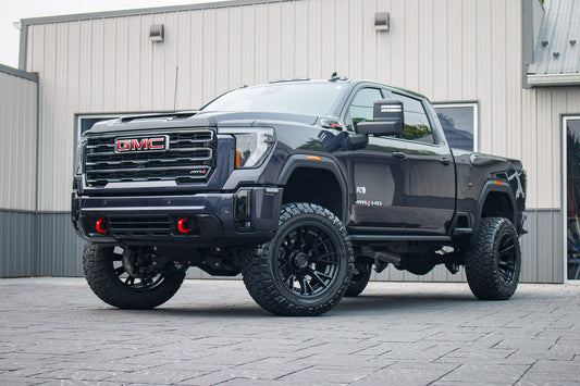 2026 GMC Sierra 2500 AT4 with a 5" BDS lift kit, 22x12 Fuel Catalyst wheels, and 37" Nitto Ridge Grappler tires.