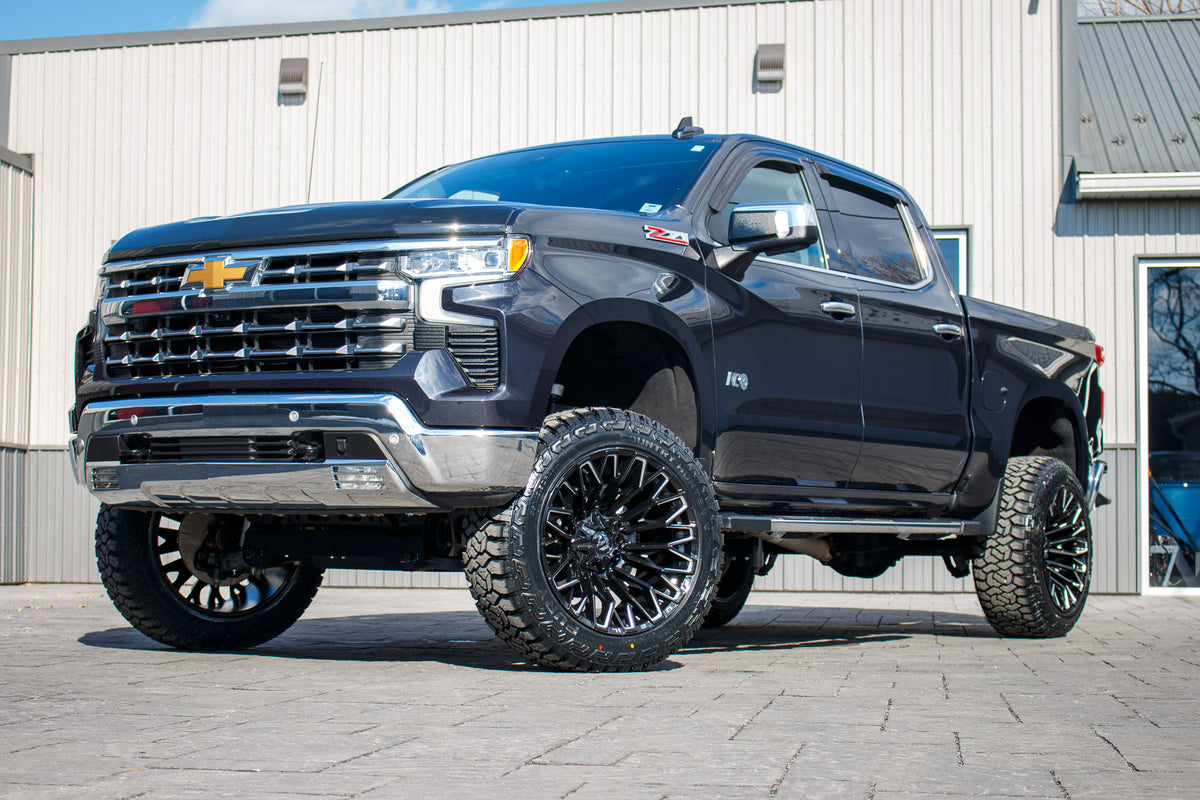 2023 Chevrolet Silverado 1500 LTZ with a 6" Rough Country lift kit, 22x12 Fuel Strike wheels, and 35" Fury Country Hunter R/T tires.
