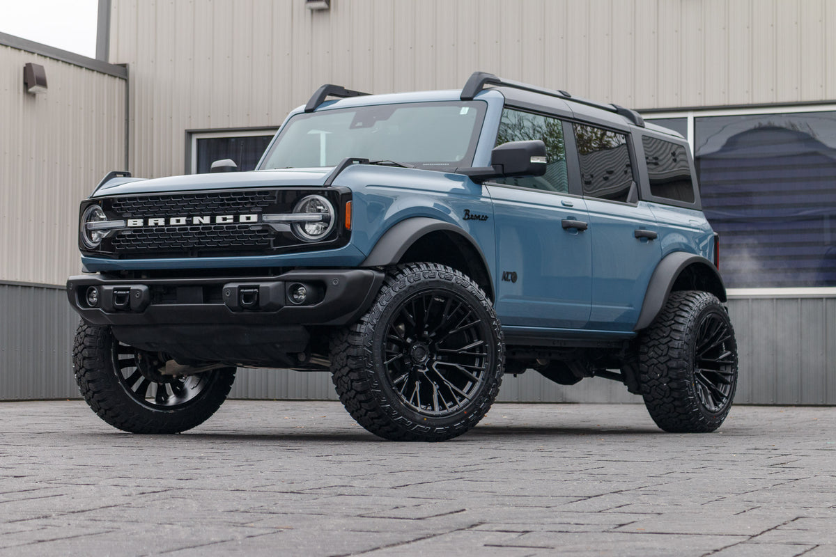 2023 Ford Bronco Wildtrak with a 2.25" Zone lift kit, 22x12 Fuel Rebar wheels, and 35" Fury Country Hunter R/T tires.