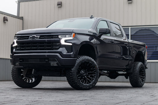 2023 Chevrolet Silverado 1500 RST with a 6" Rough Country lift kit, 22x12 Fuel Strike wheels, and 35" Fury Country Hunter R/T tires.