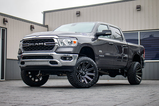 2022 Ram 1500 Big Horn with a 6" Rough Country lift kit, 22x12 Fuel Contra wheels, and 35" Fury Country Hunter R/T tires.