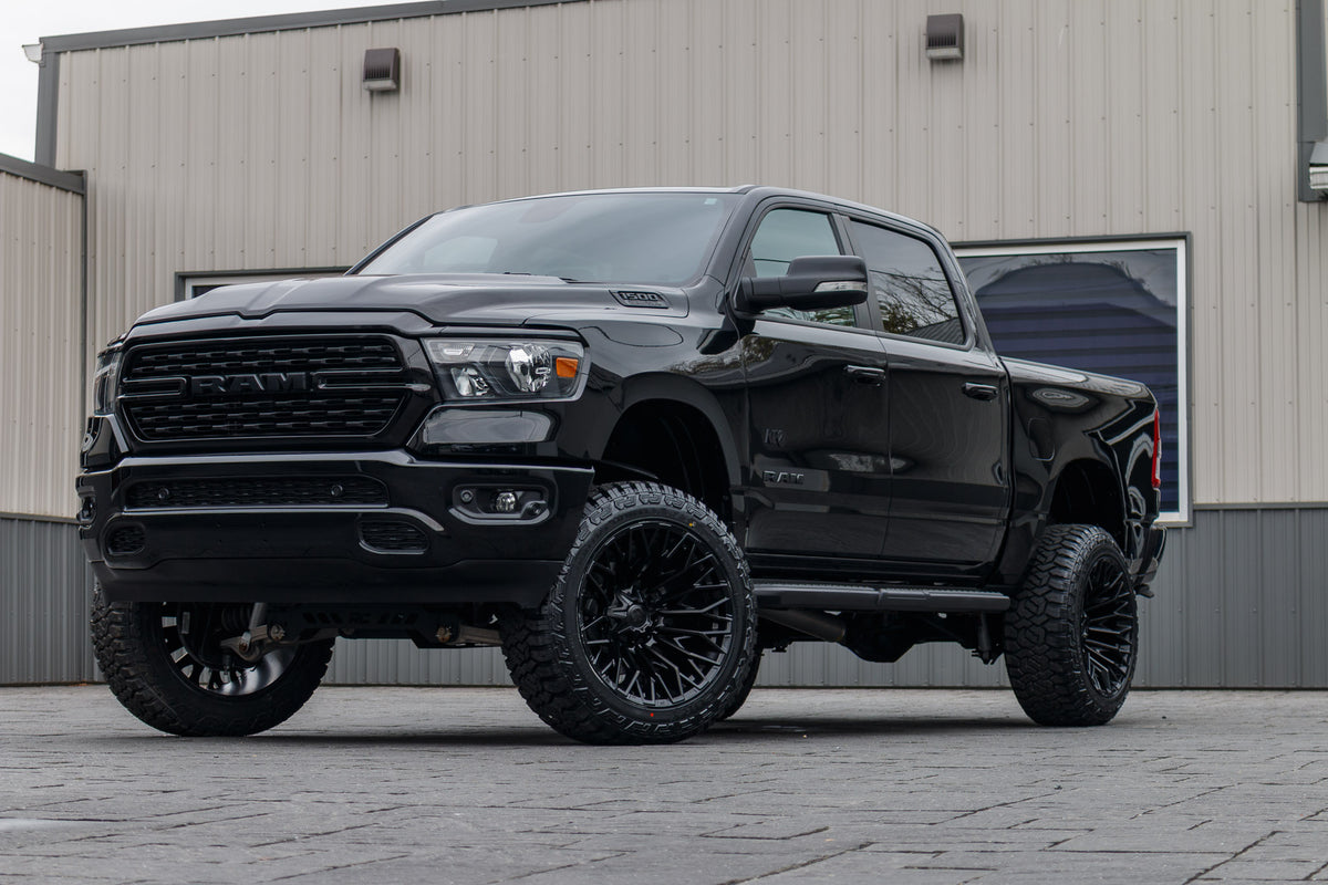 2022 Ram 1500 Big Horn with a 6" Rough Country lift kit, 22x12 Fuel Strike wheels, and 35" Fury Country Hunter R/T tires.